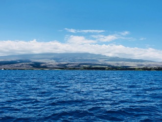 The view of the Hualalai​ volcano from the Huki Pono survey boat.